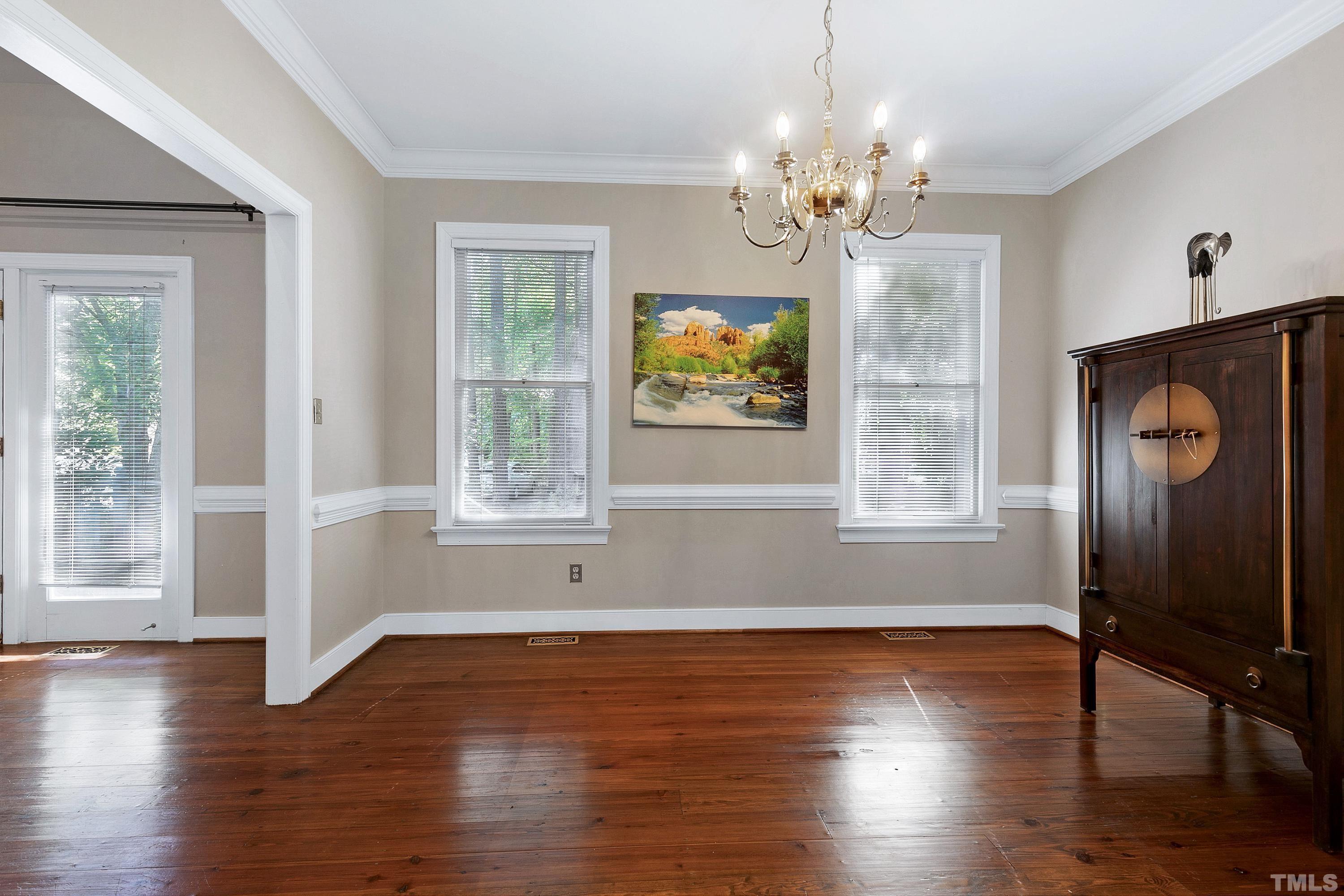 113 Palace Green Cary, NC 27518 - Photo 13 of 32 a view of empty room with wooden floor and fan