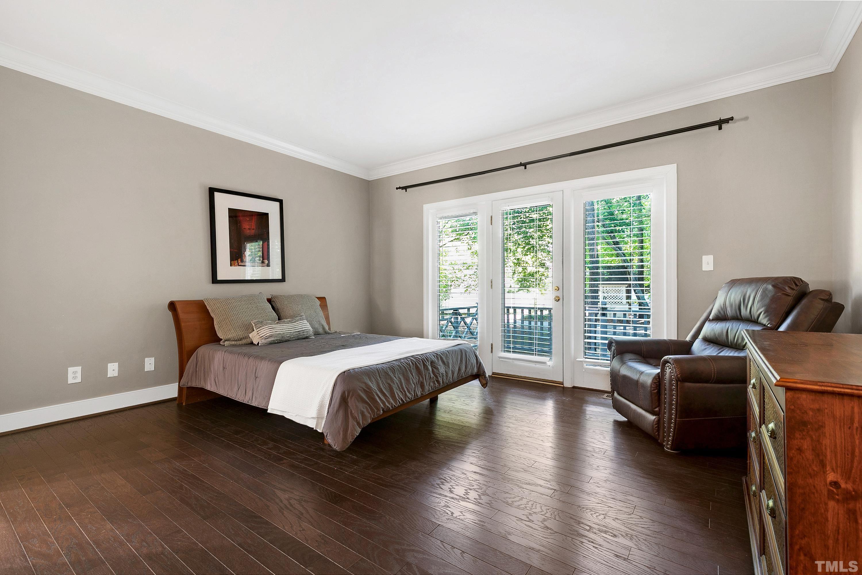 113 Palace Green Cary, NC 27518 - Photo 16 of 32 a spacious bedroom with a bed and a couch