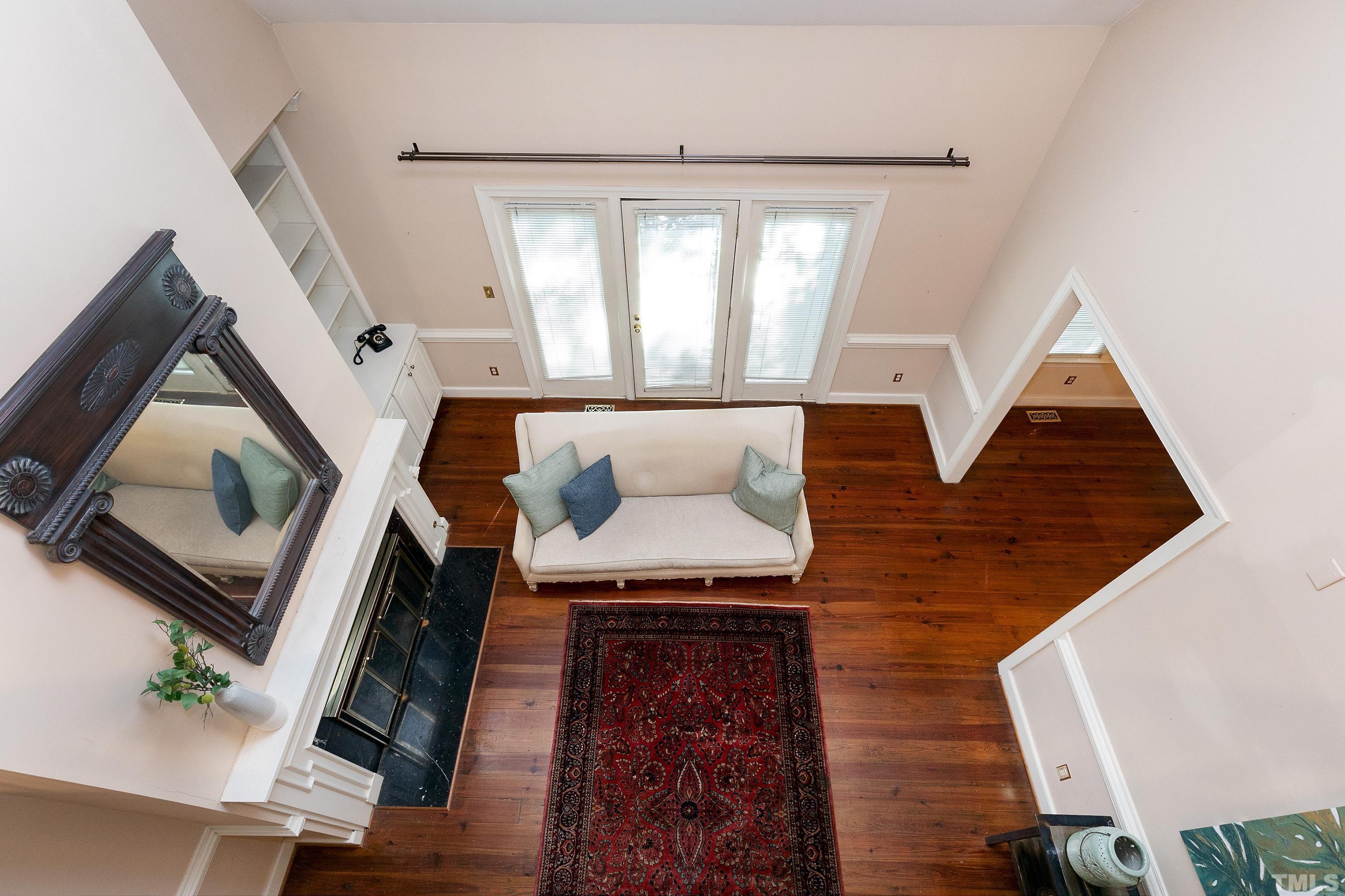 113 Palace Green Cary, NC 27518 - Photo 19 of 32 a living room with furniture and a fireplace