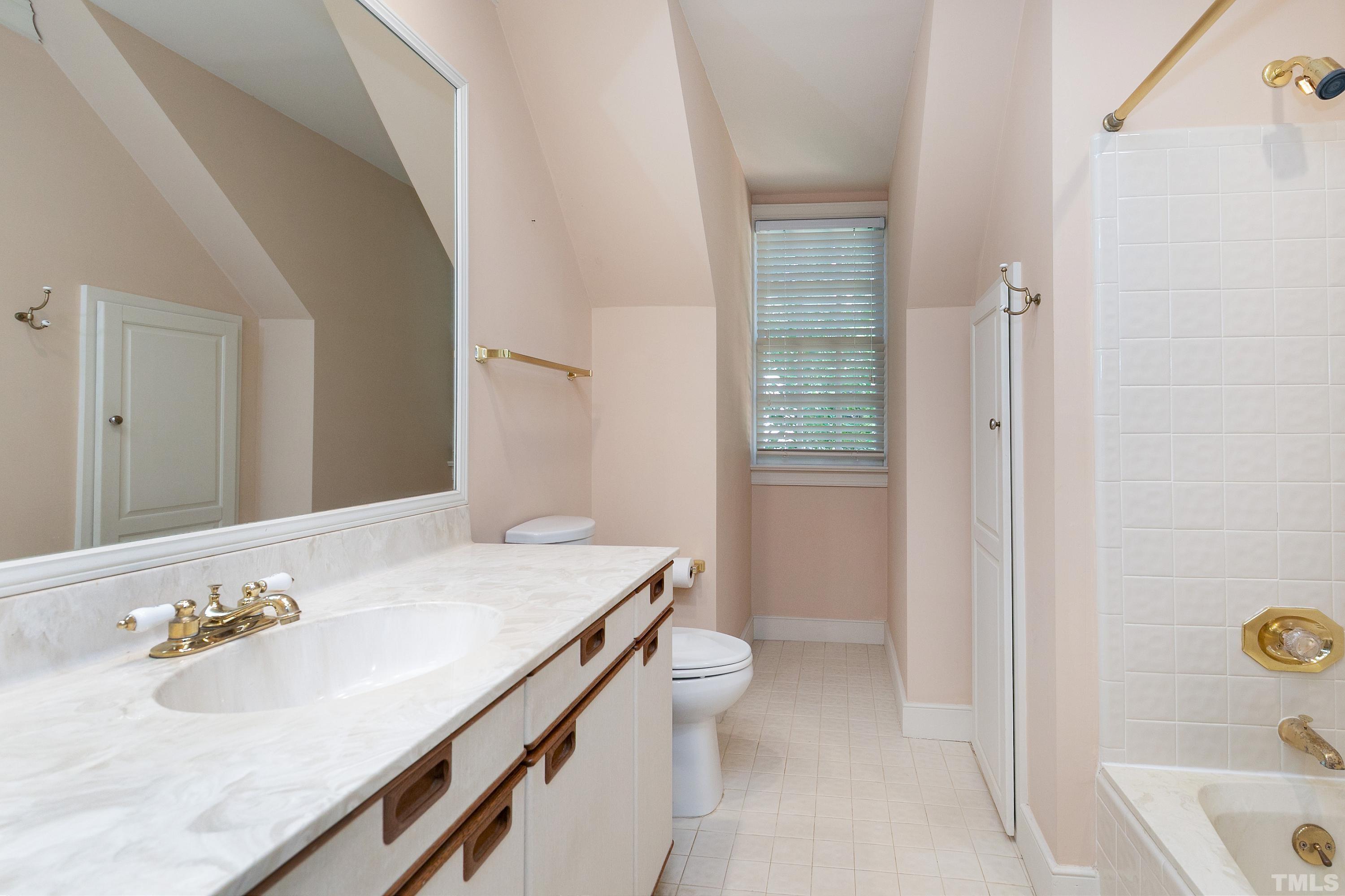 113 Palace Green Cary, NC 27518 - Photo 26 of 32 a bathroom with a sink a toilet and shower