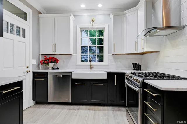 a kitchen with a sink stainless steel appliances and cabinets