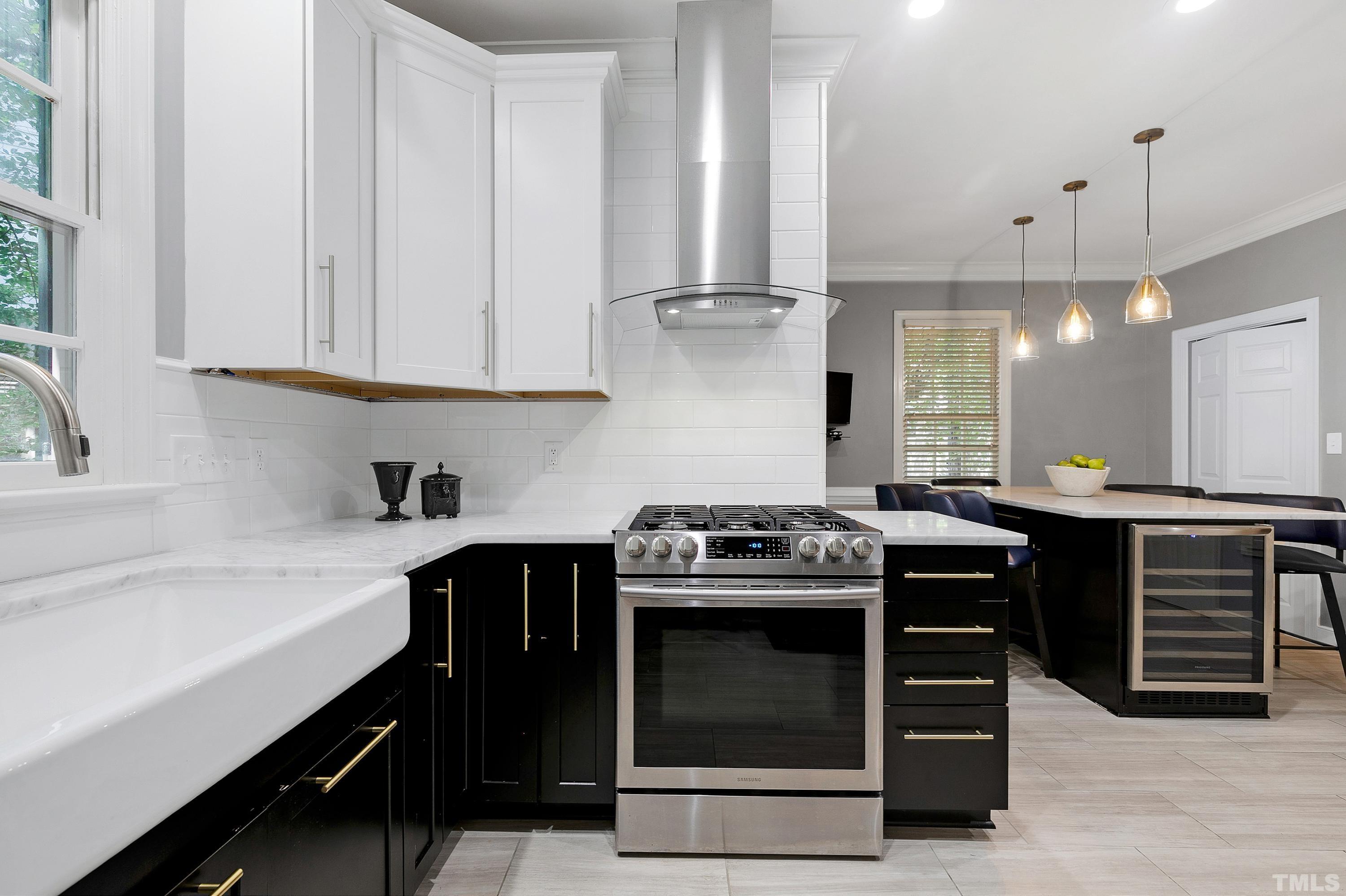 113 Palace Green Cary, NC 27518 - Photo 10 of 32 a kitchen with a stove and a sink