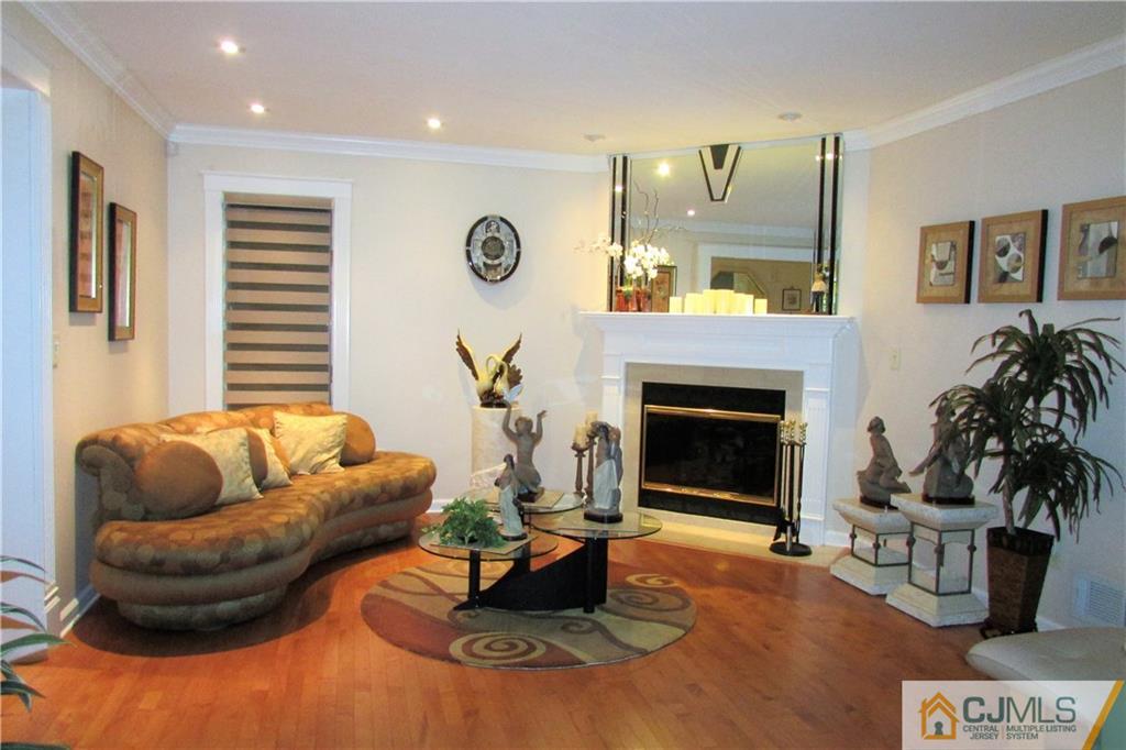 163 Redpine Loop Old Bridge, NJ 08857 - Photo 11 of 20 a living room with furniture and a fireplace