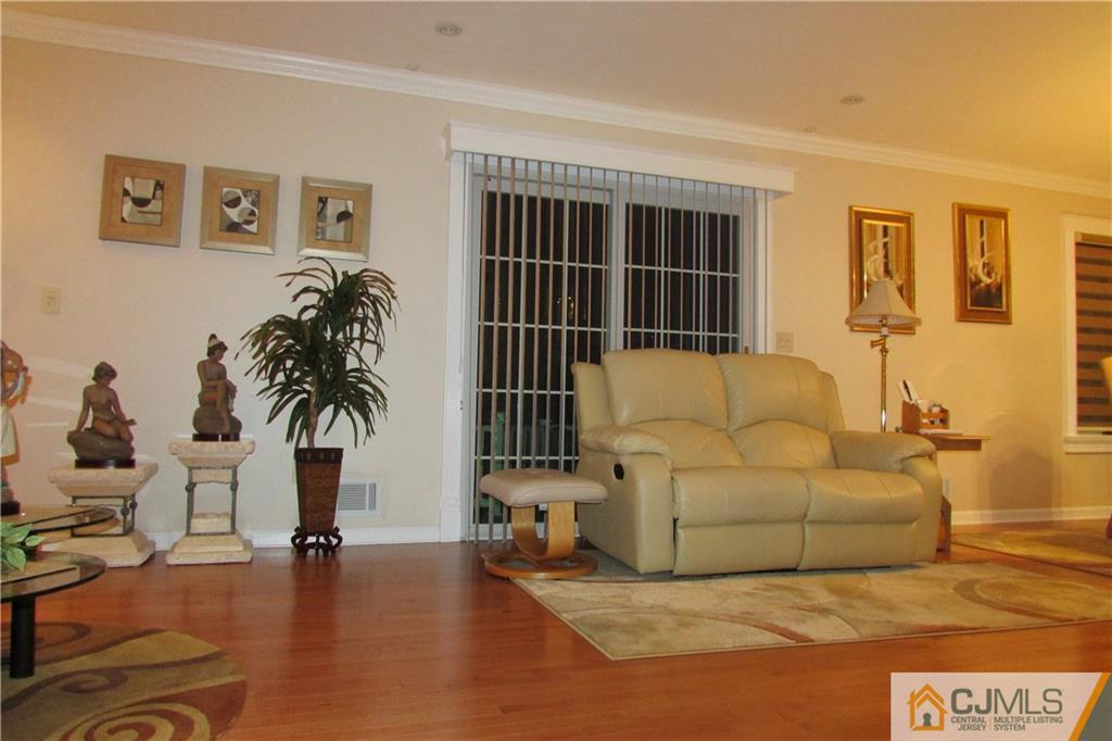 163 Redpine Loop Old Bridge, NJ 08857 - Photo 13 of 20 a living room with furniture and a potted plant