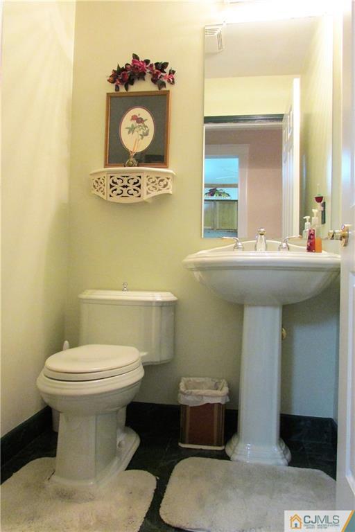 163 Redpine Loop Old Bridge, NJ 08857 - Photo 18 of 20 a bathroom with a toilet sink and mirror
