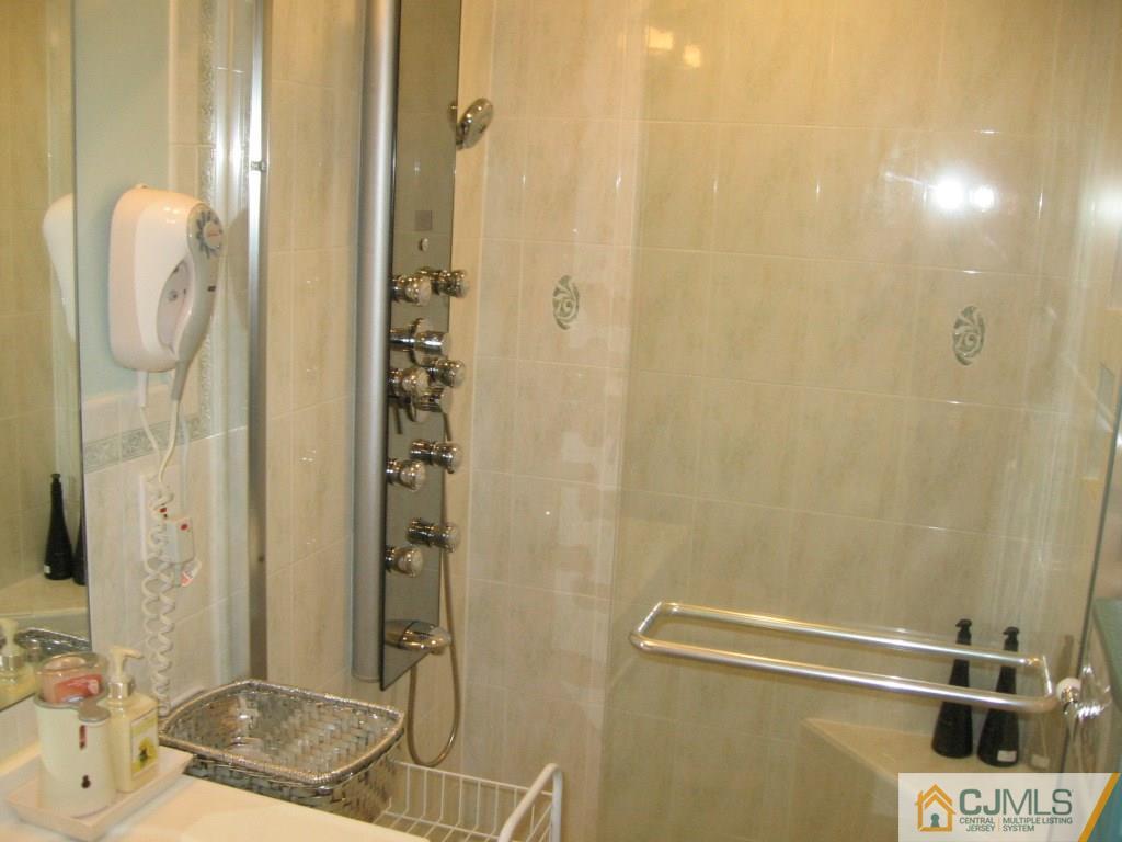 163 Redpine Loop Old Bridge, NJ 08857 - Photo 7 of 20 a bathroom with a granite countertop shower and a sink
