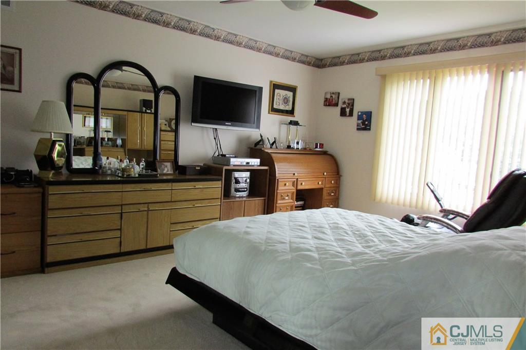 163 Redpine Loop Old Bridge, NJ 08857 - Photo 9 of 20 a bedroom with a bed and a flat screen tv