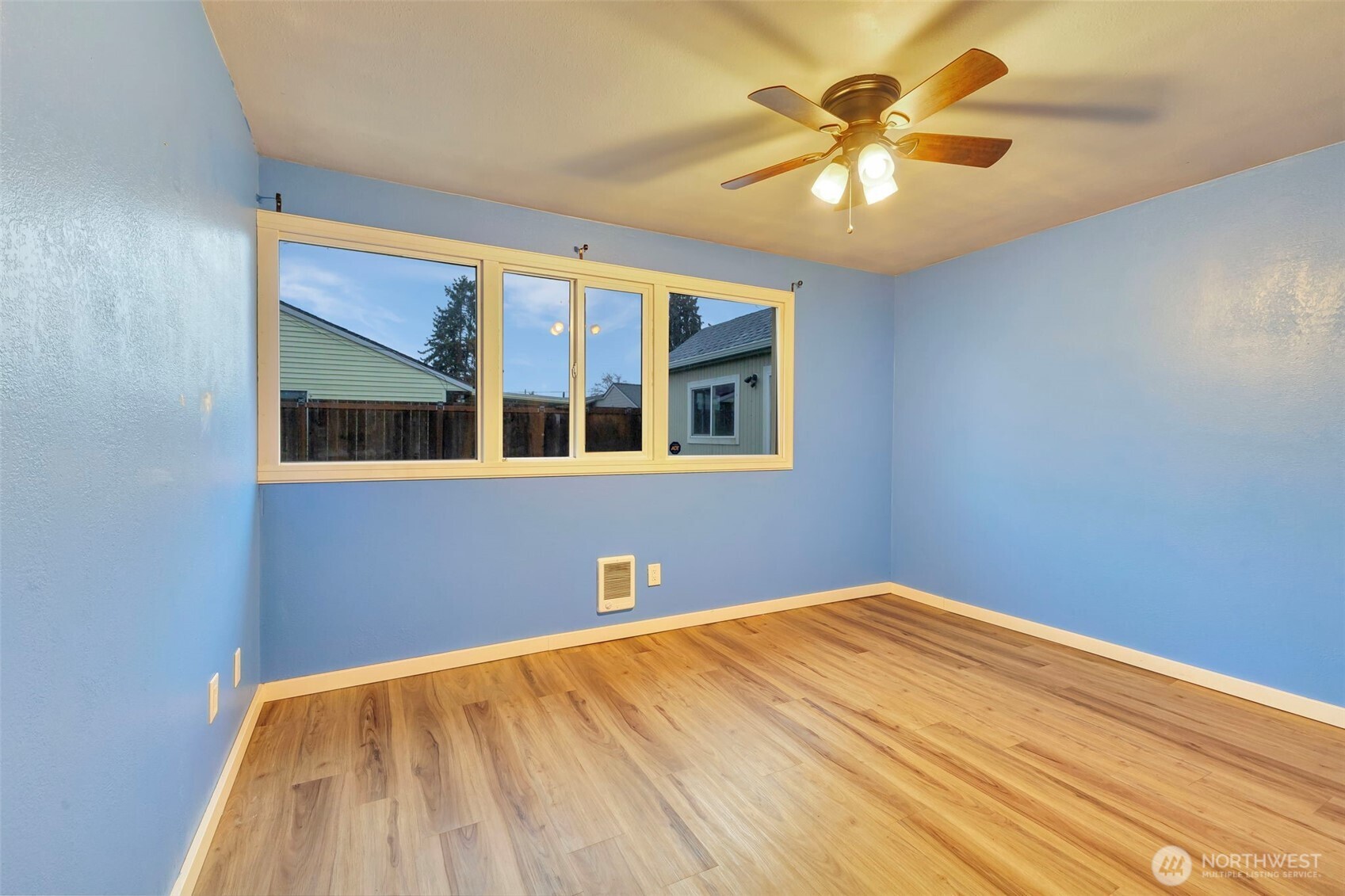 10915 Davisson Road Southwest Lakewood, WA 98499 - Photo 20 of 29 a view of an empty room with a chandelier fan