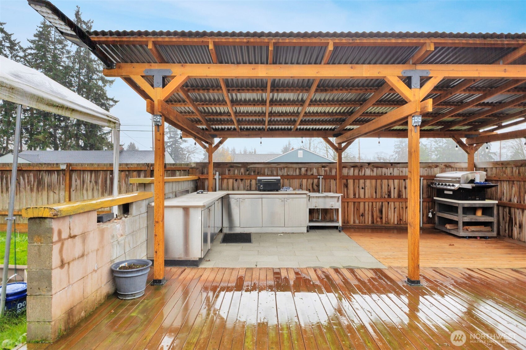10915 Davisson Road Southwest Lakewood, WA 98499 - Photo 25 of 29 a view of a swimming pool with a patio and a patio