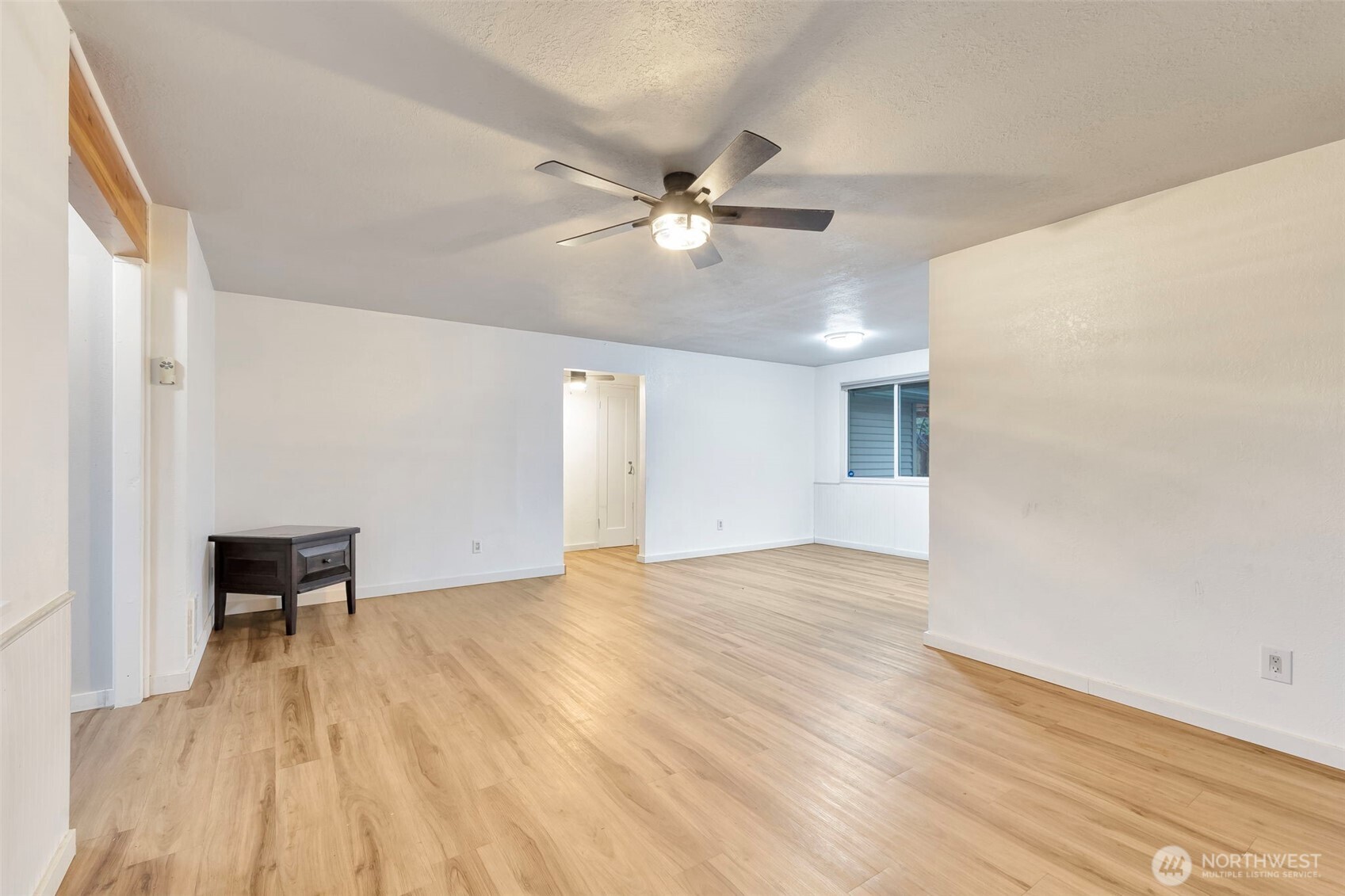 10915 Davisson Road Southwest Lakewood, WA 98499 - Photo 9 of 29 wooden floor in an empty room with a window