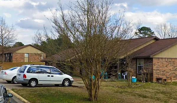 a car parked in front of a house