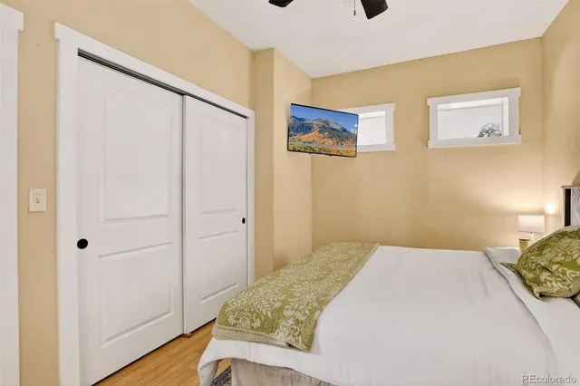 a bedroom with a bed and a area