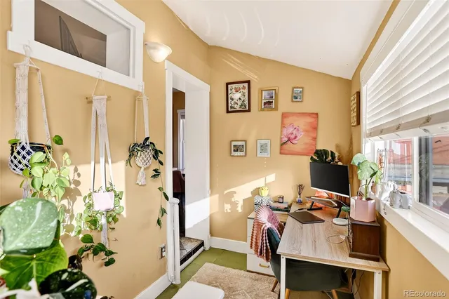 a view of a workspace with furniture