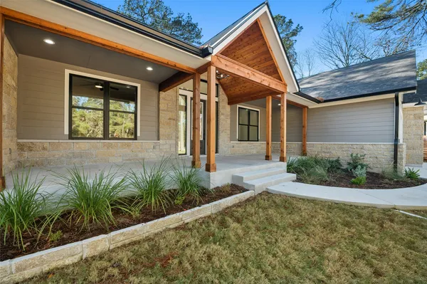 a view of a house with a small backyard