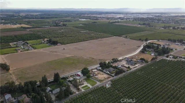 an aerial view of a house with a lake view
