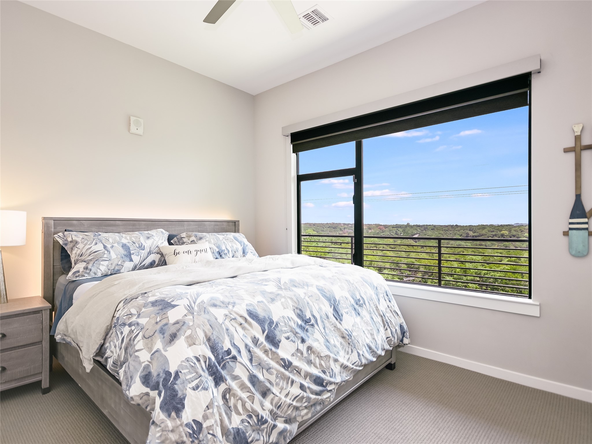5921 Hiline Road, Unit 1501 Austin, TX 78734 - Photo 19 of 38 This guest bedroom in the front of the unit is large enough for this king-size bed, includes an upgraded ceiling fan, and enjoys gorgeous sunset views.