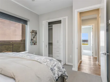 a bedroom with a bed and a view of bathroom