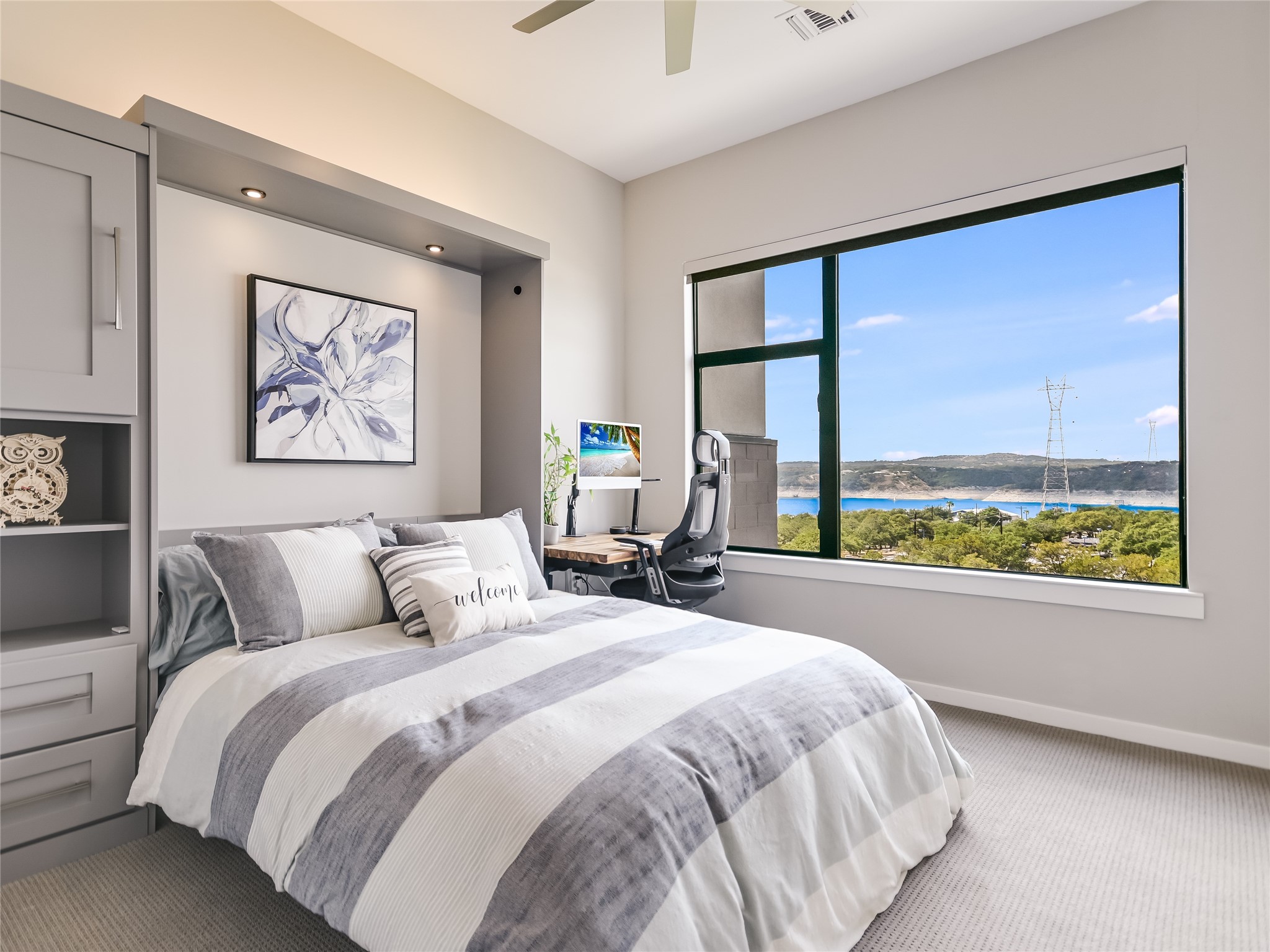 5921 Hiline Road, Unit 1501 Austin, TX 78734 - Photo 22 of 38 Another guest bedroom features an upgraded ceiling fan, an auto-powered roller window shade and large window offering gorgeous Lake Travis views.
