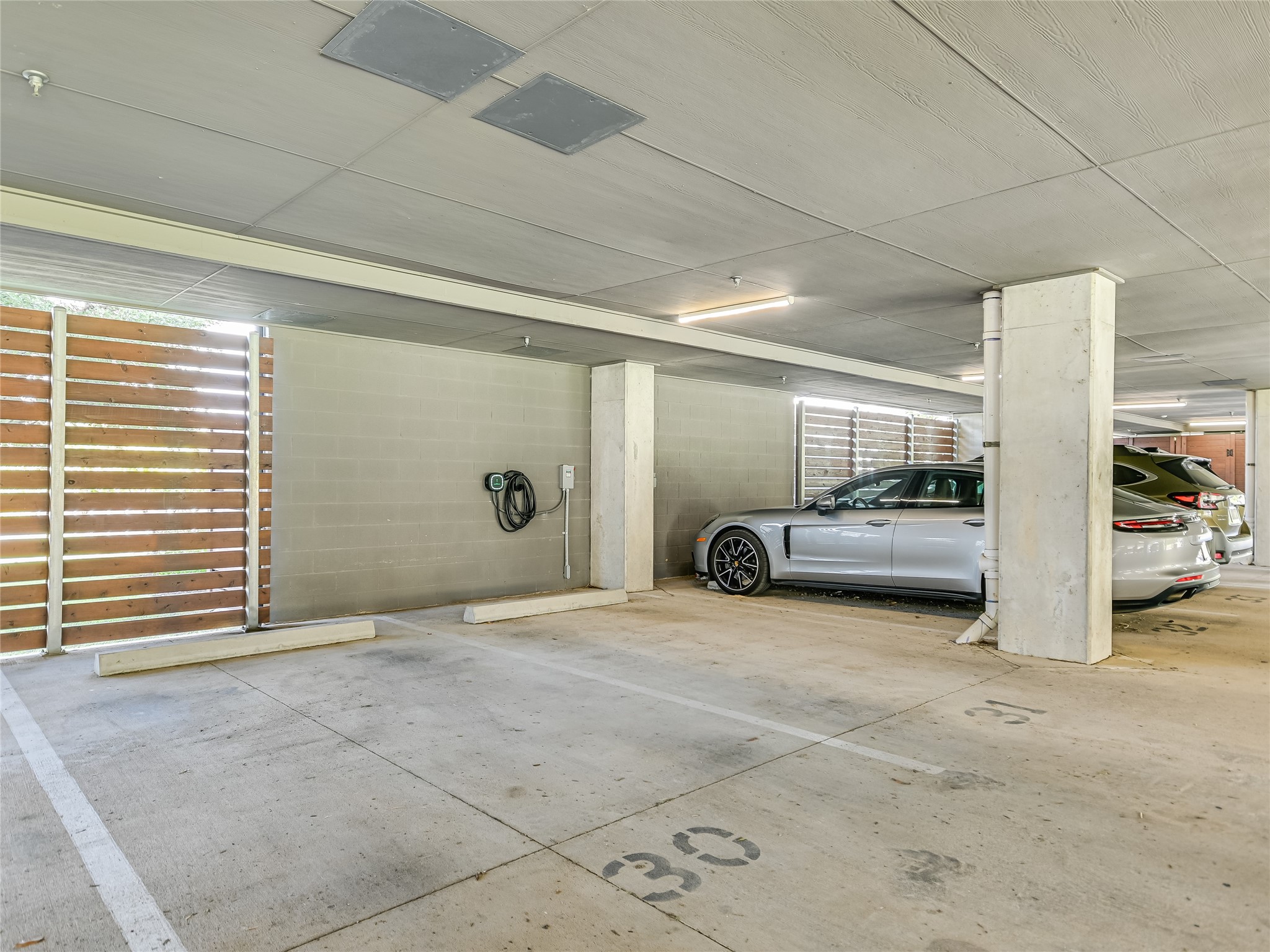 5921 Hiline Road, Unit 1501 Austin, TX 78734 - Photo 27 of 38 You also get 2 side-by-side reserved garage parking spaces (30 & 31), equipped with your very own EV charging station...Wow!