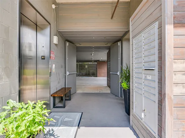 a view of a balcony with an outdoor space and seating area