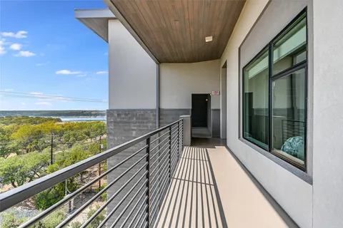 a view of balcony with wooden floor