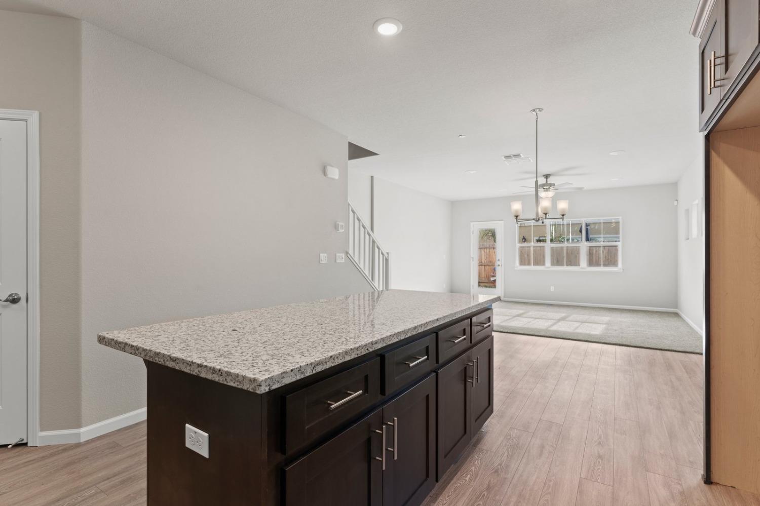 3916 Wickman Loop Rocklin, CA 95677 - Photo 11 of 40 a kitchen with a counter top space and wooden floor