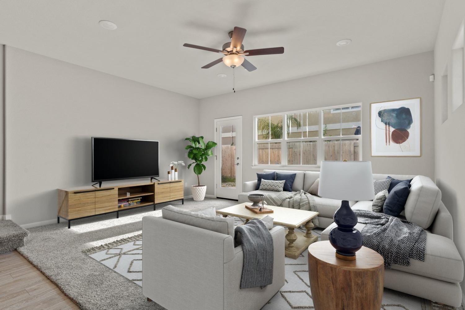 3916 Wickman Loop Rocklin, CA 95677 - Photo 14 of 40 a living room with furniture and a flat screen tv