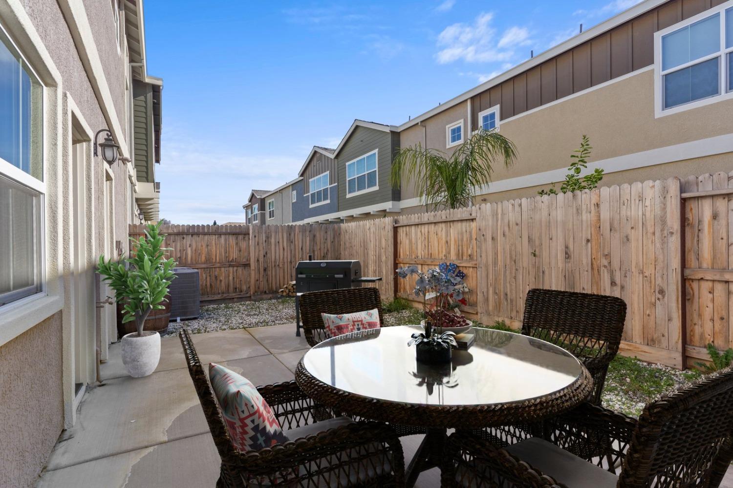 3916 Wickman Loop Rocklin, CA 95677 - Photo 17 of 40 a backyard of a house with table and chairs