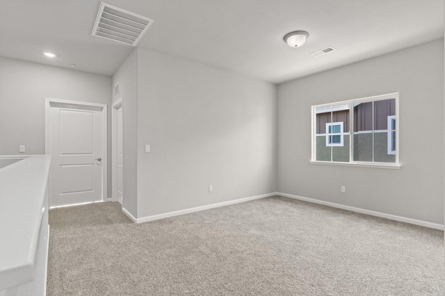 3916 Wickman Loop Rocklin, CA 95677 - Photo 22 of 40 an empty room with windows and closet