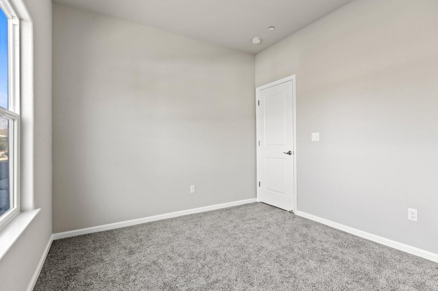 3916 Wickman Loop Rocklin, CA 95677 - Photo 23 of 40 an empty room with a natural light