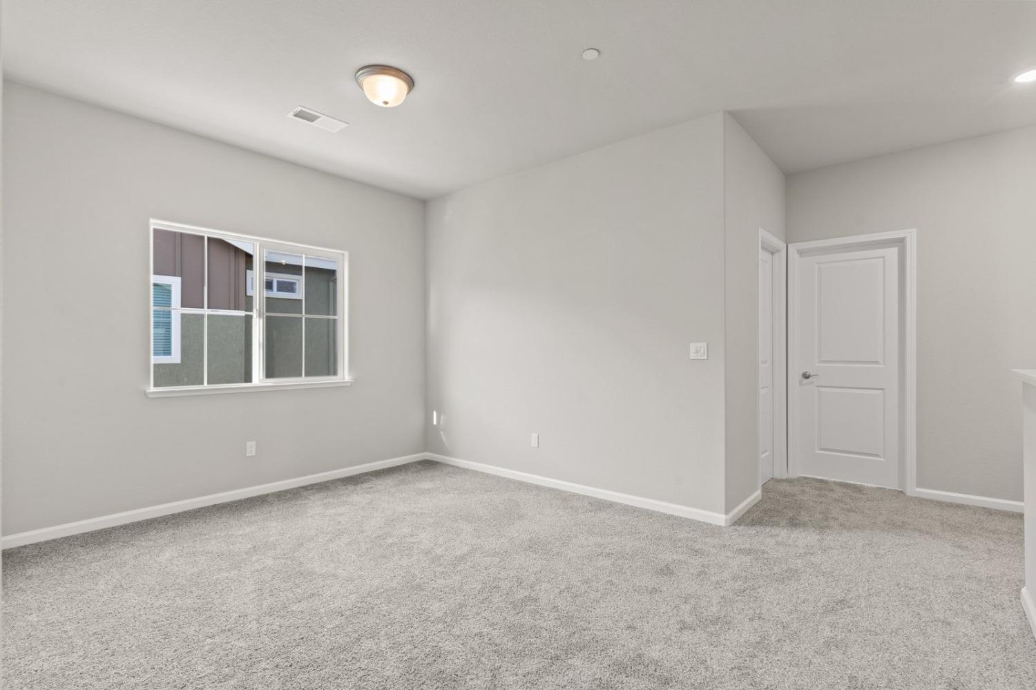 3916 Wickman Loop Rocklin, CA 95677 - Photo 26 of 40 a view of empty room with windows