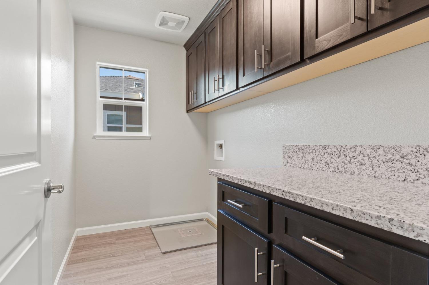 3916 Wickman Loop Rocklin, CA 95677 - Photo 30 of 40 a view of a kitchen cabinets and wooden floor