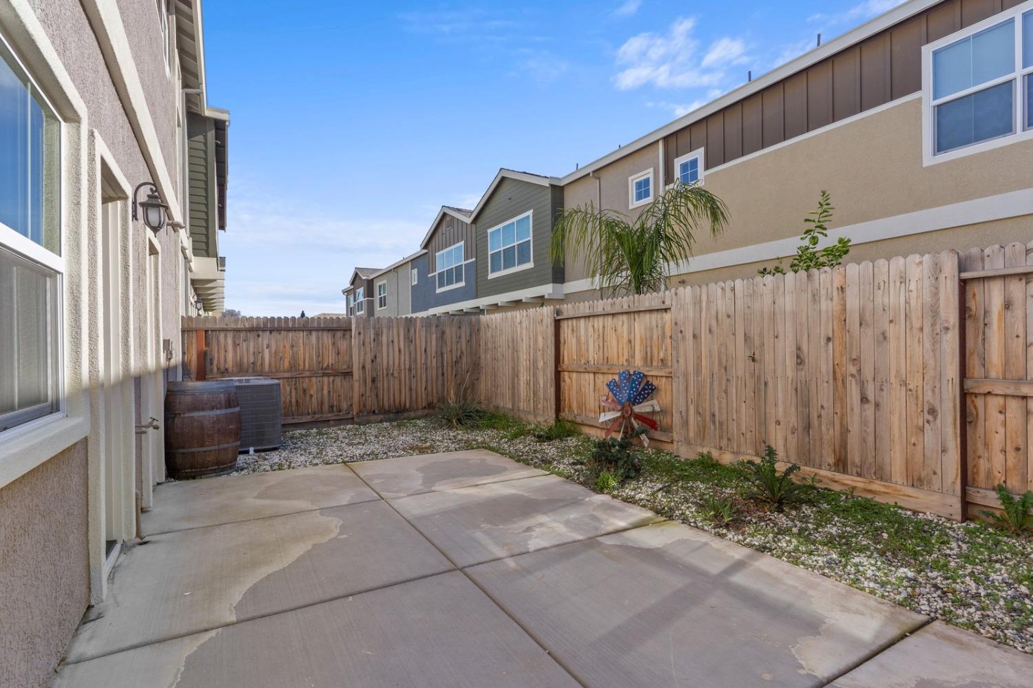 3916 Wickman Loop Rocklin, CA 95677 - Photo 40 of 40 a view of a house with a backyard and furniture