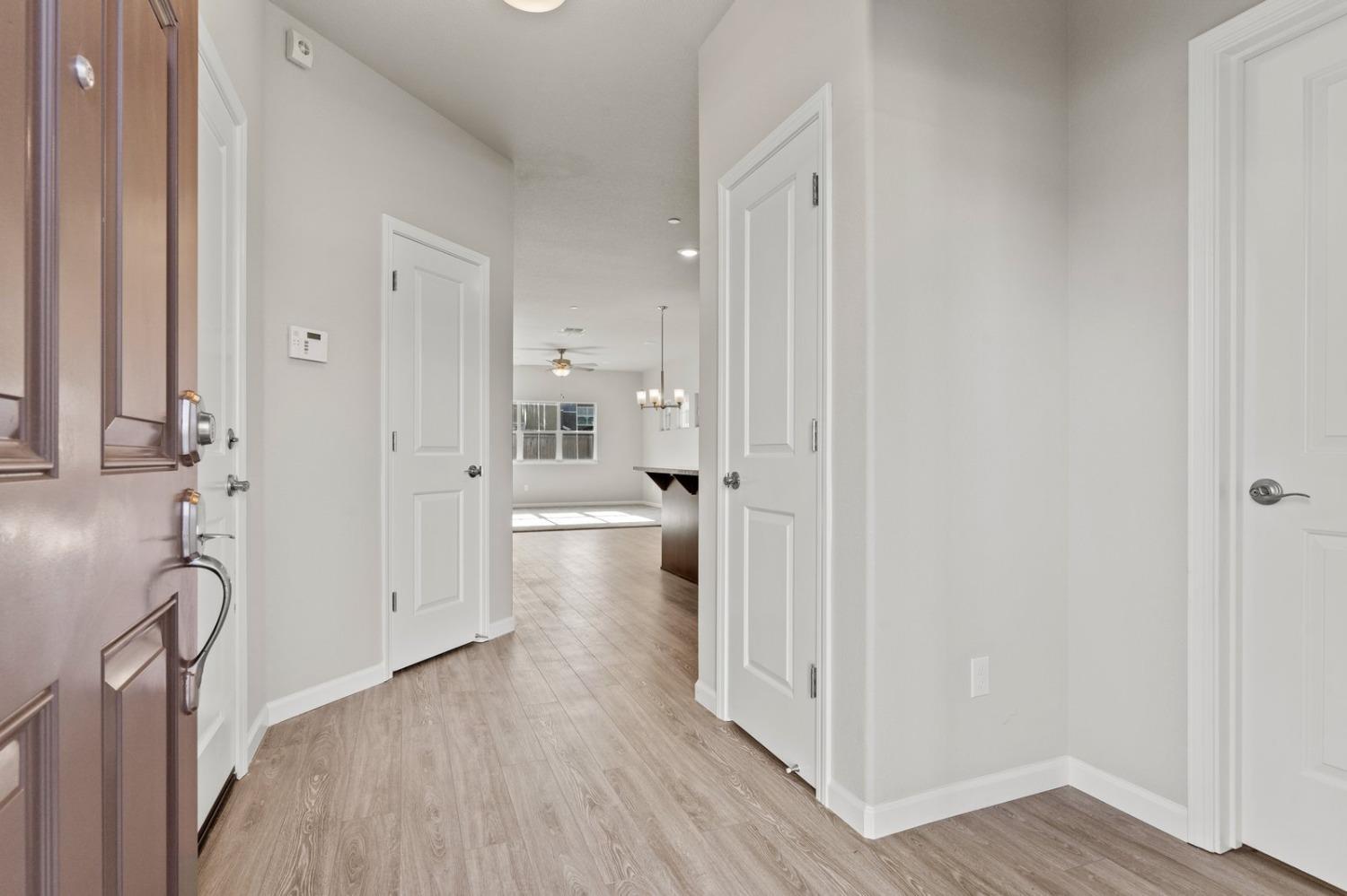 3916 Wickman Loop Rocklin, CA 95677 - Photo 5 of 40 a view of a hallway with wooden floor