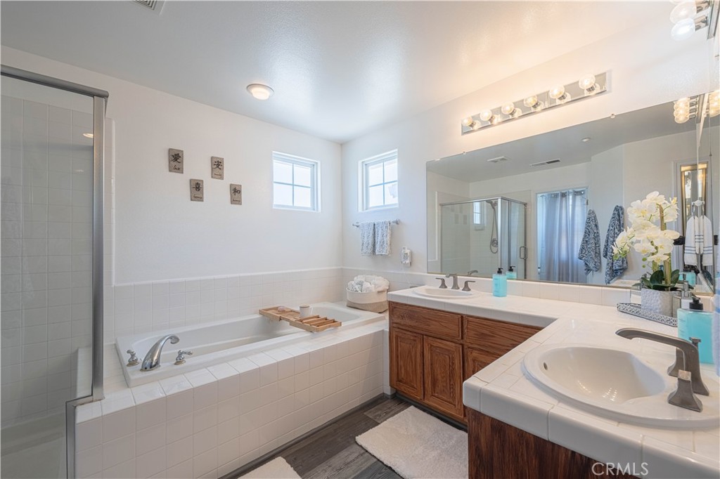 429 Tudor Way Salinas, CA 93906 - Photo 17 of 41 a bathroom with a tub sink and mirror