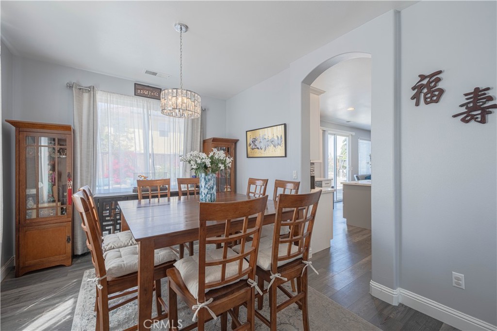 429 Tudor Way Salinas, CA 93906 - Photo 19 of 41 a dining room with furniture a chandelier and wooden floor