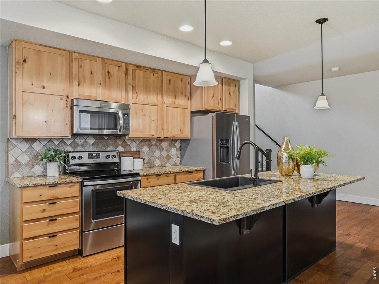 2065 Scarecrow Road Fort Collins, CO 80525 - Photo 16 of 50 Nice sized kitchen island - room for 3 to 4 bar stools
