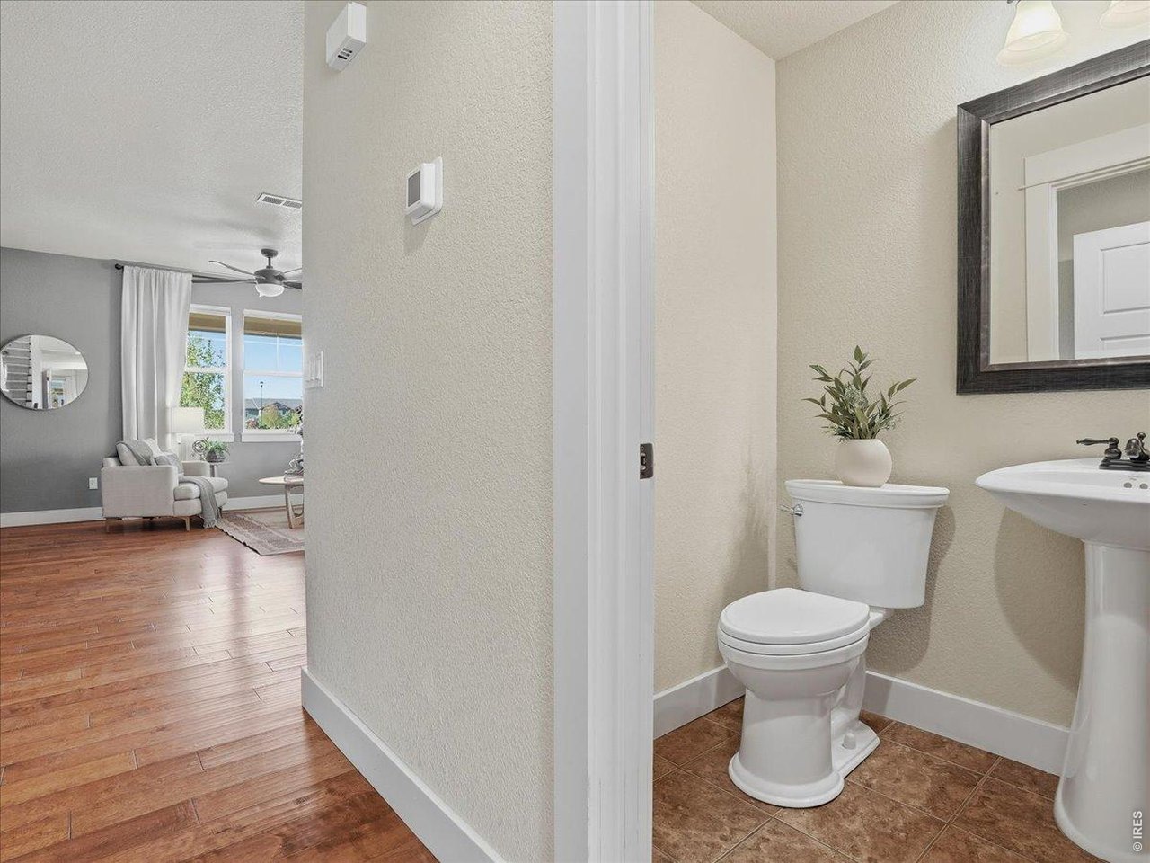 2065 Scarecrow Road Fort Collins, CO 80525 - Photo 28 of 50 Convenient half bathroom on the main floor with tile flooring
