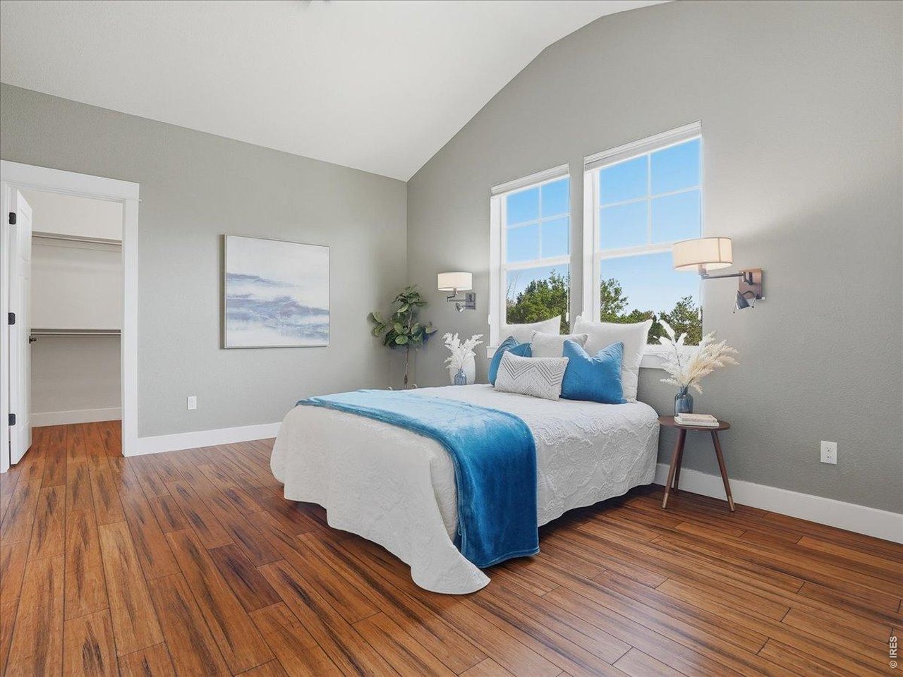 2065 Scarecrow Road Fort Collins, CO 80525 - Photo 31 of 50 Primary bedroom with newer wood flooring and walk in closet