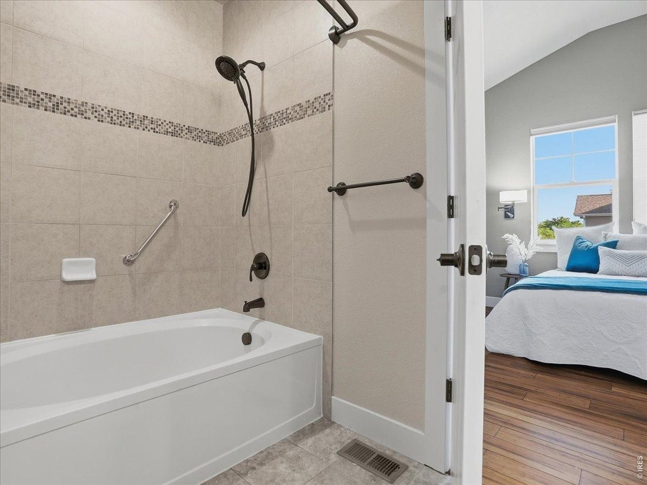 2065 Scarecrow Road Fort Collins, CO 80525 - Photo 32 of 50 Primary bathroom has an oversized tub / shower, granite counter tops and tile flooring