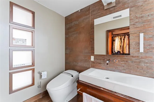 a bathroom with a sink a toilet and tub