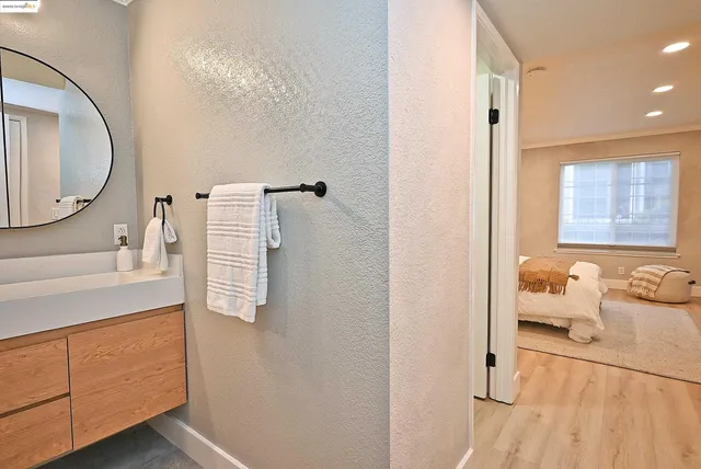 a en suite bathroom with a sink and mirror
