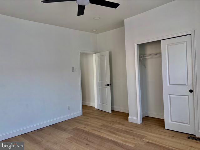 1817 South 5th Street Philadelphia, PA 19148 - Photo 14 of 23 an empty room with wooden floor and windows