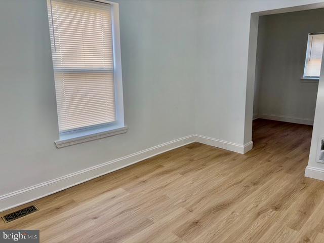 1817 South 5th Street Philadelphia, PA 19148 - Photo 20 of 23 an empty room with wooden floor and windows
