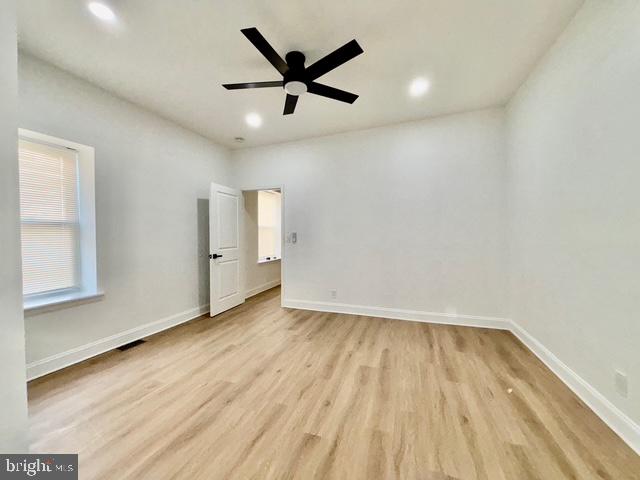 1817 South 5th Street Philadelphia, PA 19148 - Photo 9 of 23 an empty room with wooden floor and windows