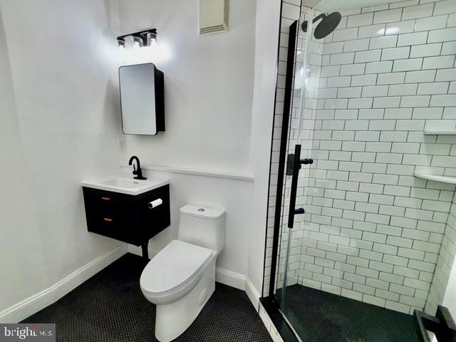 1817 South 5th Street Philadelphia, PA 19148 - Photo 10 of 23 a bathroom with a toilet sink and mirror