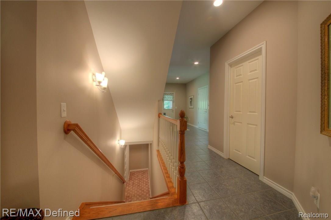 3505 Moceri Court Rochester, MI 48306 - Photo 48 of 64 Back hallway and stairs to the finished basement