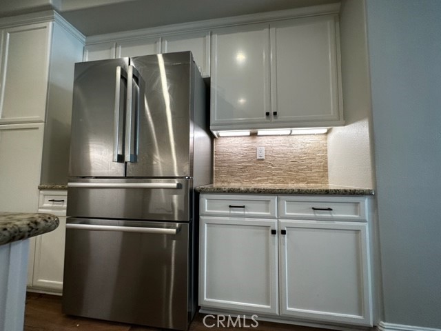 11 Corte Javier San Clemente, CA 92673 - Photo 12 of 30 a metallic refrigerator freezer sitting inside of a kitchen