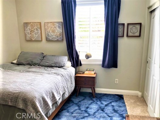 11 Corte Javier San Clemente, CA 92673 - Photo 26 of 30 a bedroom with a bed and painting on the wall