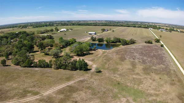 an aerial view of a house with a lake view